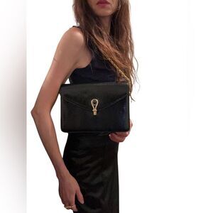 Gucci Black and Gold Leather Clutch